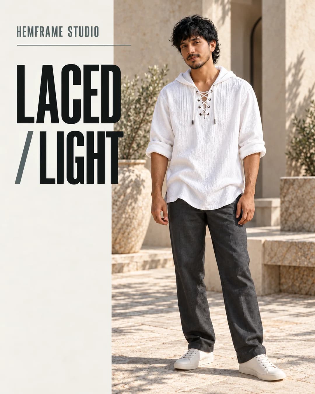 Laced / Light: White lace-up hooded shirt in a stone courtyard